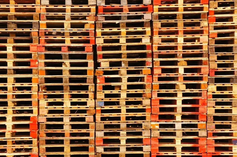 Stacked wooden pallets in a yard